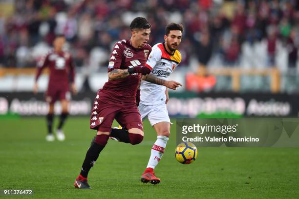 Daniele Baselli of Torino FC in action against Danilo Cataldi of Benevento Calcio during the Serie A match between Torino FC and Benevento Calcio at...