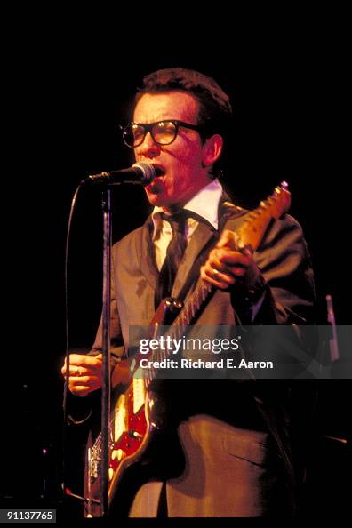 Elvis Costello performs live on stage with The Attractions at the