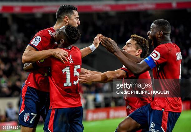 Lille's Portuguese defender Edgar Ie celebrates with teammates after scoring a goal during the French L1 football match between Lille and Strasbourg...
