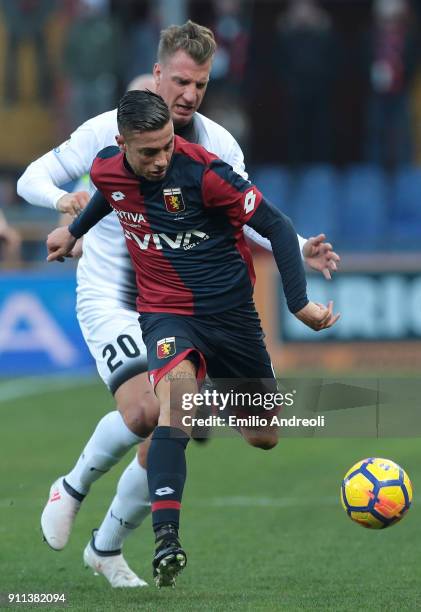Armando Izzo of Genoa CFC competes for the ball with Maxi Lopez of Udinese Calcio during the serie A match between Genoa CFC and Udinese Calcio at...