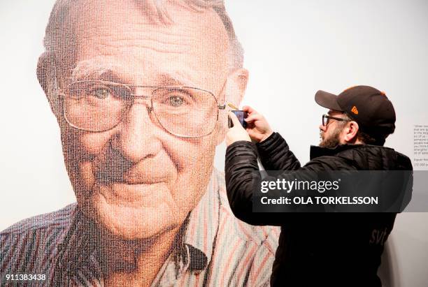 Visitor takes a mobile photo of a picture of Ingvar Kamprad, founder of Swedish multinational furniture retailer IKEA, at the IKEA museum in Almhult,...