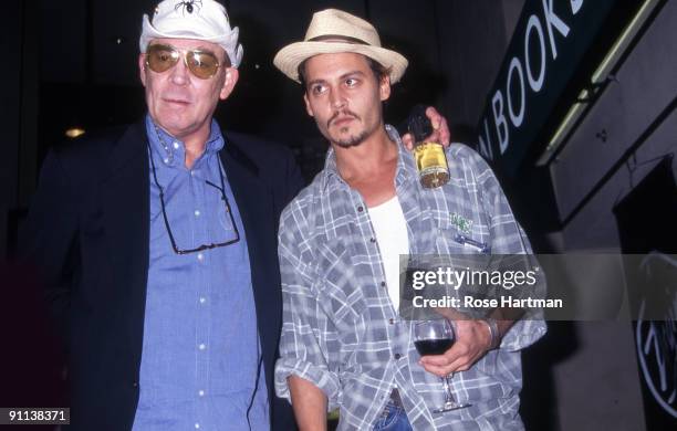 Author Hunter S. Thompson and actor Johnny Depp attend a book signing at Virgin Megastore, New York, 1998.