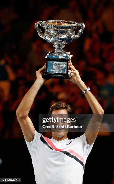 Roger Federer of Switzerland poses with the Norman Brookes Challenge Cup after winning the 2018 Australian Open Men's Singles Final against Marin...