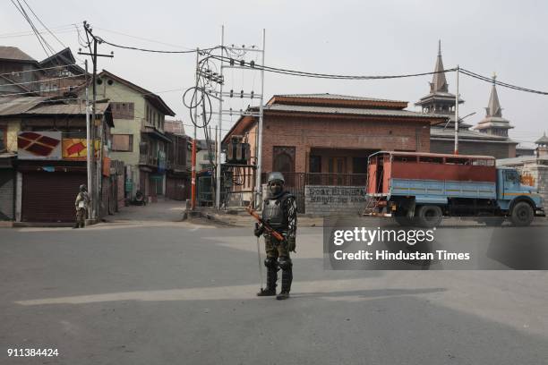 Paramilitary soldiers stand guard during restrictions in downtown area, on January 28, 2018 in Srinagar, India. Authorities imposed restrictions in...