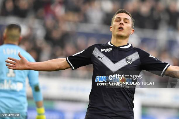 Bordeaux's French forward Nicolas De Preville celebrates after scoring a goal during the French Ligue 1 football match between Bordeaux and Lyon on...