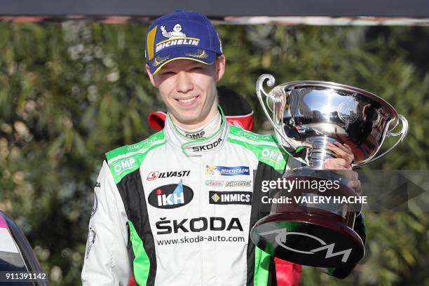 Finnish pilot Kalle Rovanpera poses during the podium ceremony for the R5 category of the Monte Carlo Rally in Monaco on January 28, 2018. / AFP...