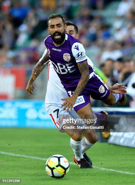 Diego Castro of the Glory competes for the ball against Steven Lustica of the Wanderers during the round 18 A-League match between the Perth Glory...