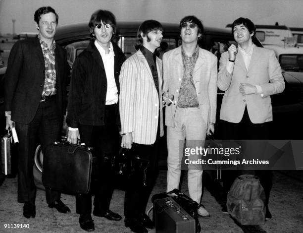 Photo of BEATLES and Brian EPSTEIN; L-R. Brian Epstein, George Harrison, Ringo Starr, John Lennon, Paul McCartney arriving back at Heathrow from...
