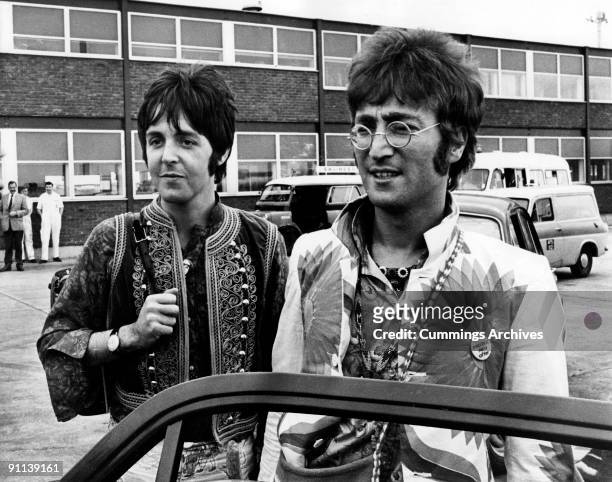 Photo of BEATLES and Paul McCARTNEY and John LENNON; John Lennon & Paul McCartney returning to Heathrow Airport from holiday in Greece