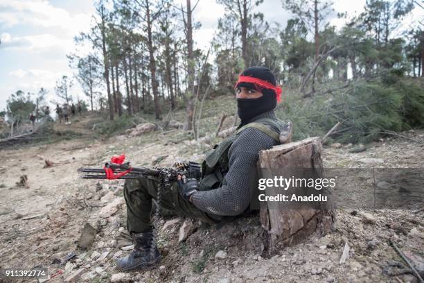 Free Syrian Army member, backed by Turkish Army, is seen at Burseya Mountain after Turkish military aircrafts hit PYD/PKK terror group targets and...