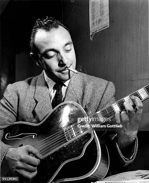 1st JANUARY: Photo of Django REINHARDT playing his guitar backstage in New York in 1946.