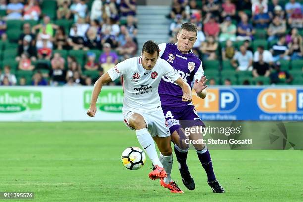 Oriol Riera of the Wanderers and Shane Lowry of the Glory compete for the ball during the round 18 A-League match between the Perth Glory and the...