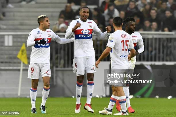 Lyon's Brazilian defender Marcelo celebrates with teammates after scoring a goal during the French Ligue 1 football match between Bordeaux and Lyon...