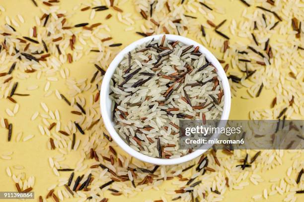 black, white and red rice. traditional food. - brown rice stock pictures, royalty-free photos & images