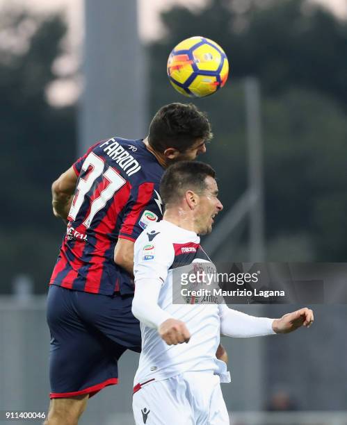 Davide Faraoni of Crotone competes for the ball in air with Simone Padoin of Cagliari during the serie A match between FC Crotone and Cagliari Calcio...