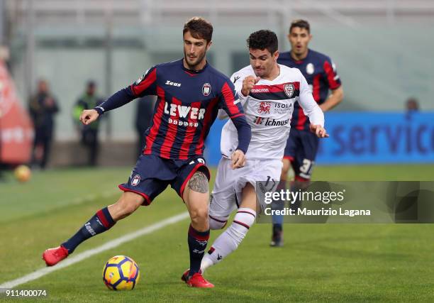 Andrea Barberis of Crotone competes for the ball with Diego Farias of Cagliari during the serie A match between FC Crotone and Cagliari Calcio at...