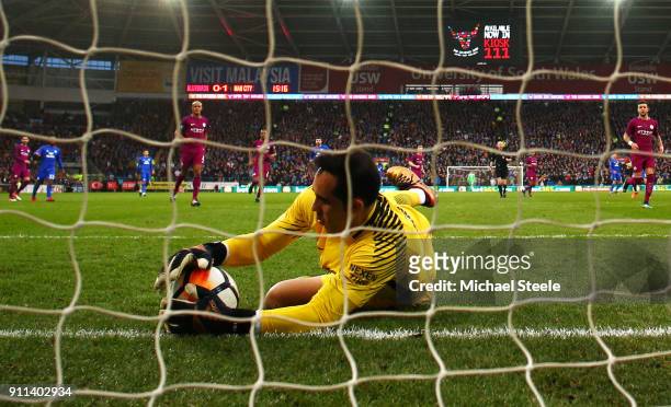 Claudio Bravo of Manchester City makes a save on the line during The Emirates FA Cup Fourth Round match between Cardiff City and Manchester City on...