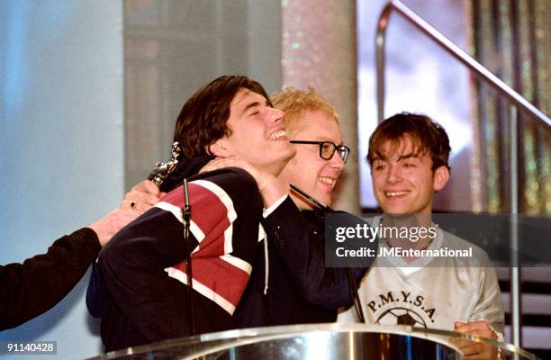 Photo of Vic REEVES and BLUR and Alex JAMES and Damon ALBARN, L-R: Alex James, Vic Reeves, Damon Albarn - Vic Reeves presenting Blur with award at...