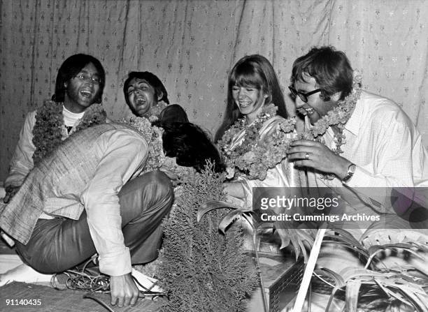 Photo of Jane ASHER and Mal EVANS and BEATLES; L-R. John Lennon, Paul McCartney, George Harrison, Jane Asher, Mal Evans at a party to celebrate...