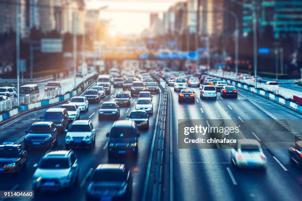 rush-hour traffic in downtown beijing - busy street imagens e fotografias de stock