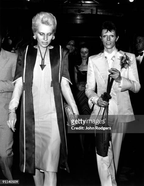 Photo of Angie BOWIE and David BOWIE; with wife Angie Bowie at Cafe Royal