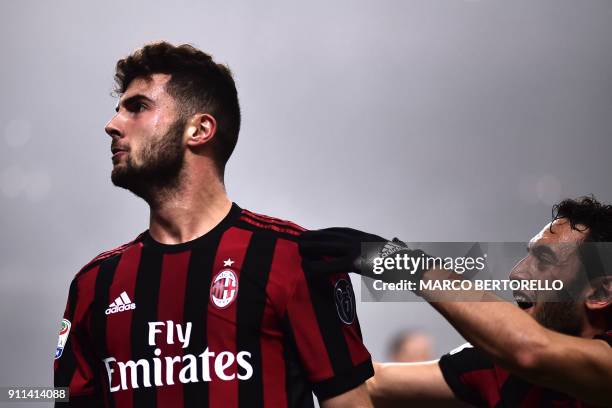 Milan's forward Patrick Cutrone from Italy celebrates with teammates after scoring during the Italian Serie A football match AC Milan Vs Lazio on...