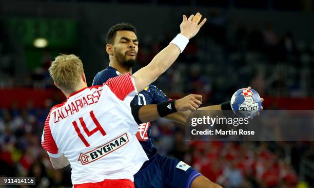 Michael Guigou of France challenges Anders Zachariassen of Denmark during the Men's Handball European Championship 3rd place match between France and...