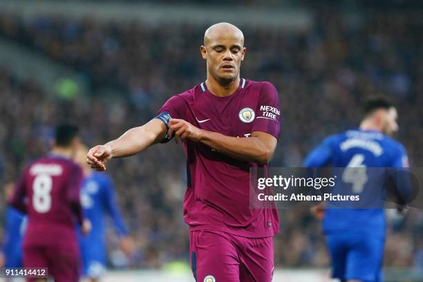 Vincent Kompany of Manchester City readjusts his captains armband during the Fly Emirates FA Cup Fourth Round match between Cardiff City and...