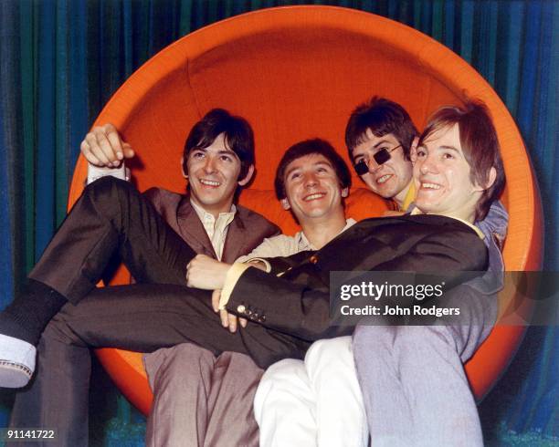 Photo of MODS and SMALL FACES; L-R: Ian McLagan, Kenney Jones, Ronnie Lane, Steve Marriott, posed, group shot, in 1960s chair