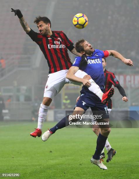 Giacomo Bonaventura of AC Milan competes for the ball with Senad Lulic of SS Lazio during the serie A match between AC Milan and SS Lazio at Stadio...