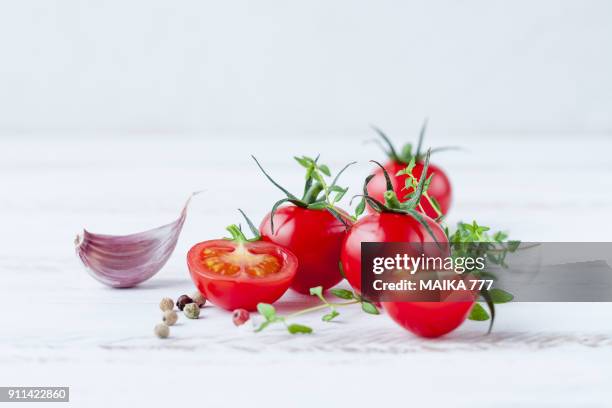 cherry tomatoes on a white wooden background - plant de tomate bildbanksfoton och bilder