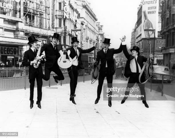 Photo of UNDERTAKERS; L-R Brian Jones, Bugs Pemberton, Jackie Lomax, Chris Huston, Geoff Nugent posed in Piccadilly Circus