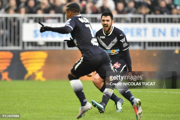 Bordeaux's French forward Gaetan Laborde reacts as Bordeaux's Brazilian forward Malcom celebrates after scoring a goal during the French L1 football...