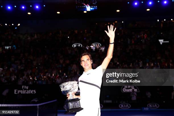 Roger Federer of Switzerland waves to the crowd as he leaves the court with the Norman Brookes Challenge Cup after winning the 2018 Australian Open...