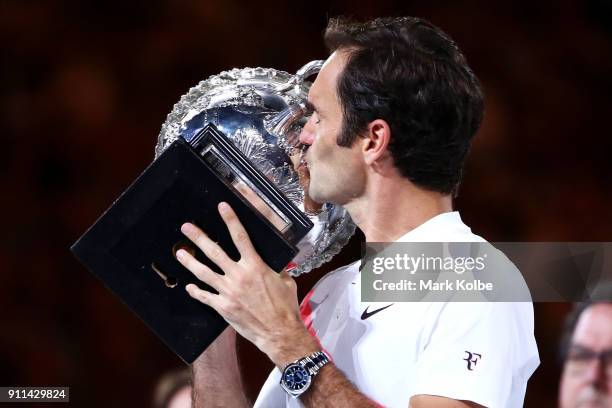 Roger Federer of Switzerland kisses the Norman Brookes Challenge Cup after winning the 2018 Australian Open Men's Singles Final against Marin Cilic...