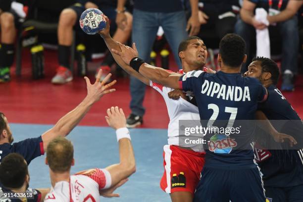 France's Cedric Sorhaindo and France's Adrien Dipanda hold off Denmark's Mads Mensah Larsen during the match for third place of the Men's 2018 EHF...