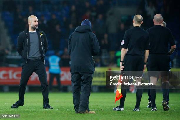 Manchester City manager Pep Guardiola walks away from the match officials after confronting referee Lee Mason after the final whistle of the Fly...