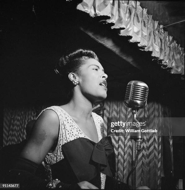 February 1947: Photo of American jazz singer Billie Holiday performing at the Club Downbeat in Manhattan.