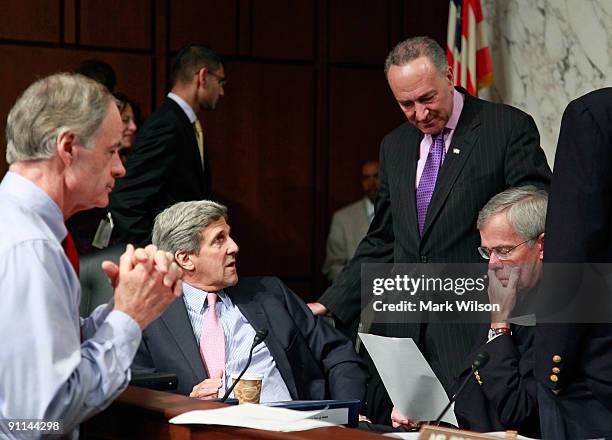 Sen. Thomas Carper , Sen. John Kerry , Sen. Charles Schumer and Sen. Jeff Bingaman , confer during a Senate Finance Committee mark up session on...