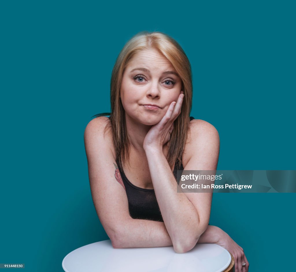 Young woman sitting at table