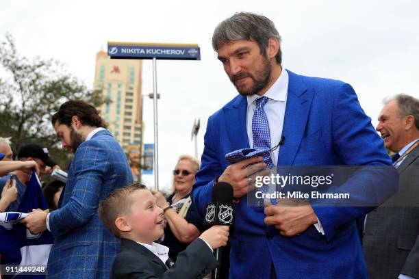 Alexander Ovechkin of the Washington Capitals gets interveiwed after arriving on the red carpet prior to the 2018 Honda NHL All-Star Game at Amalie...