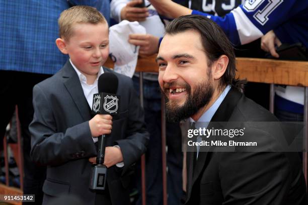 Drew Doughty of the Los Angeles Kings gets interviewed after arriving on the red carpet prior to the 2018 Honda NHL All-Star Game at Amalie Arena on...