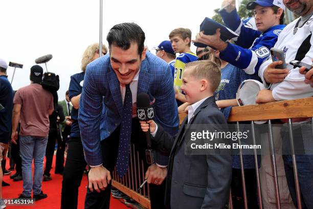 Brian Boyle of the New Jersey Devils gets interviewed after arriving on the red carpet prior to the 2018 Honda NHL All-Star Game at Amalie Arena on...