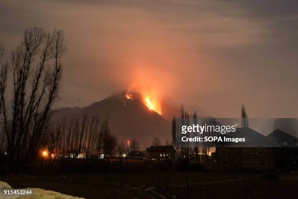 Flames and smoke rise from the Zabarwan mountains in Srinagar, Indian administered Kashmir. A major fire engulfed in the Zabarwan range at Brein...