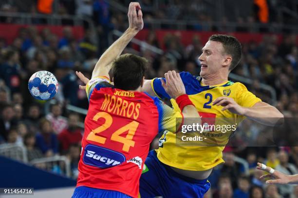 Sweden's Philip Henningsson passes the ball under pressure from Spain's Viran Morros de Argila during the final match of the Men's 2018 EHF European...