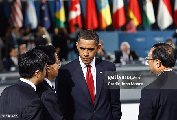 President Barack Obama and Chinese President Hu Jintao speak at the plenary session of the G-20 summit on September 25, 2009 in Pittsburgh,...