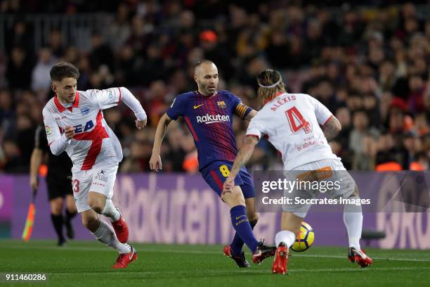 Alvaro Medran of Deportivo Alaves, Andries Iniesta of FC Barcelona, Alexis Ruano of Deportivo Alaves during the La Liga Santander match between FC...