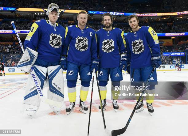 Andrei Vasilevskiy, Steven Stamkos, Nikita Kucherov and Brayden Point of the Tampa Bay Lightning pose for a group photo during warm-up prior to the...