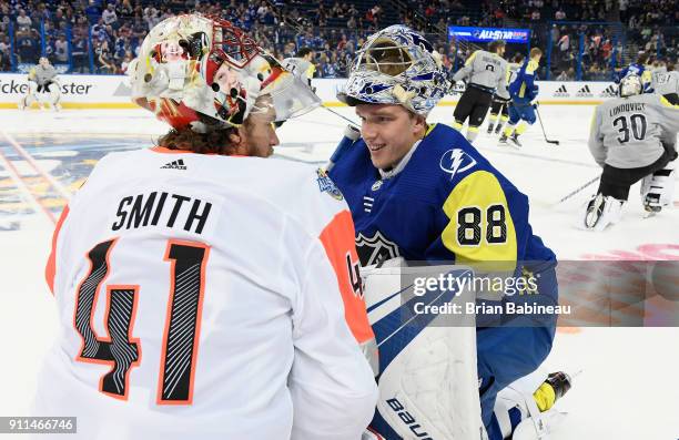 Mike Smith of the Calgary Flames and Andrei Vasilevskiy of the Tampa Bay Lightning talk during warm-up prior to the 2018 Honda NHL All-Star Game at...