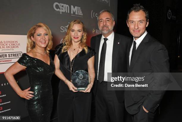 Anna Smith, Kate Winslet, winner of The Dilys Powell Award for Excellence in Film, Rich Cline and Jude Law attend the London Film Critics' Circle...